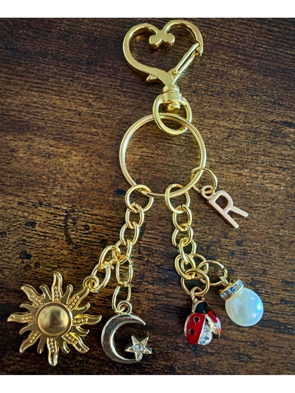 Gold Tone Charm Keychain with Sun, Moon, Ladybug, Pearl, and Customizable Letter